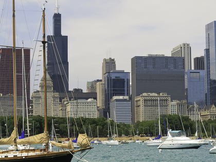 Cityscape in summer Chicago skyline as seen from Monroe Harbor, with Willis Tower (formerly known as Sears Tower) in background at left